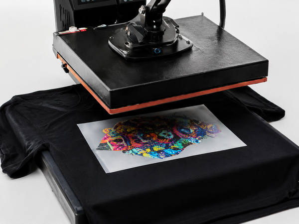 Applying a DTF transfer to a black T-shirt with a heat press